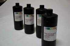 image of cmyk ink bottles : alpha dog ada signs